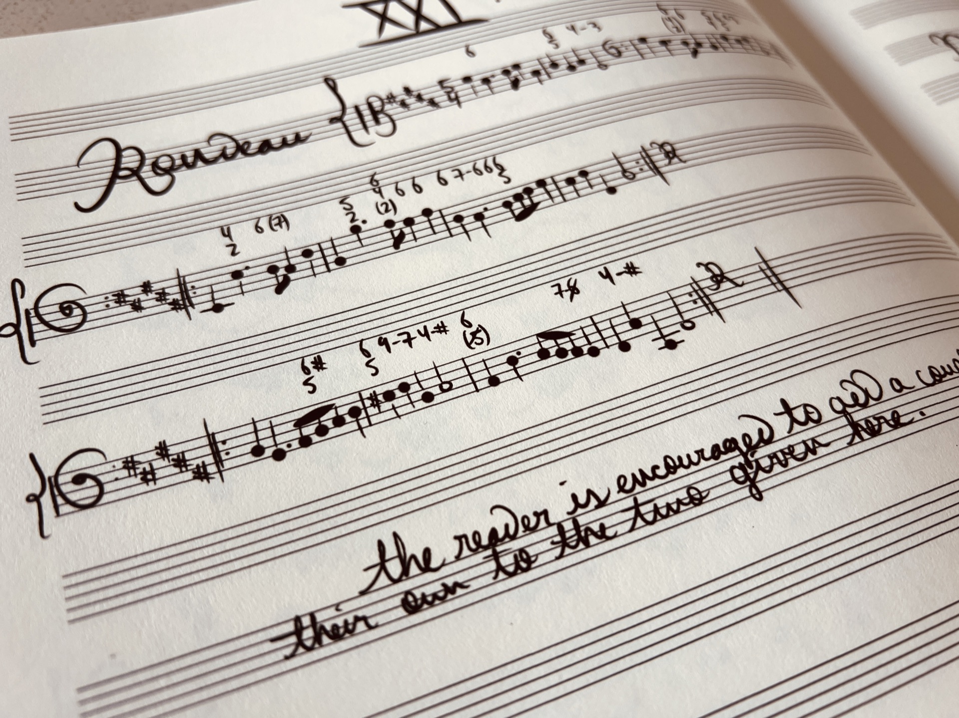 Pianist studying harmony at the keyboard with sheet music and chord charts