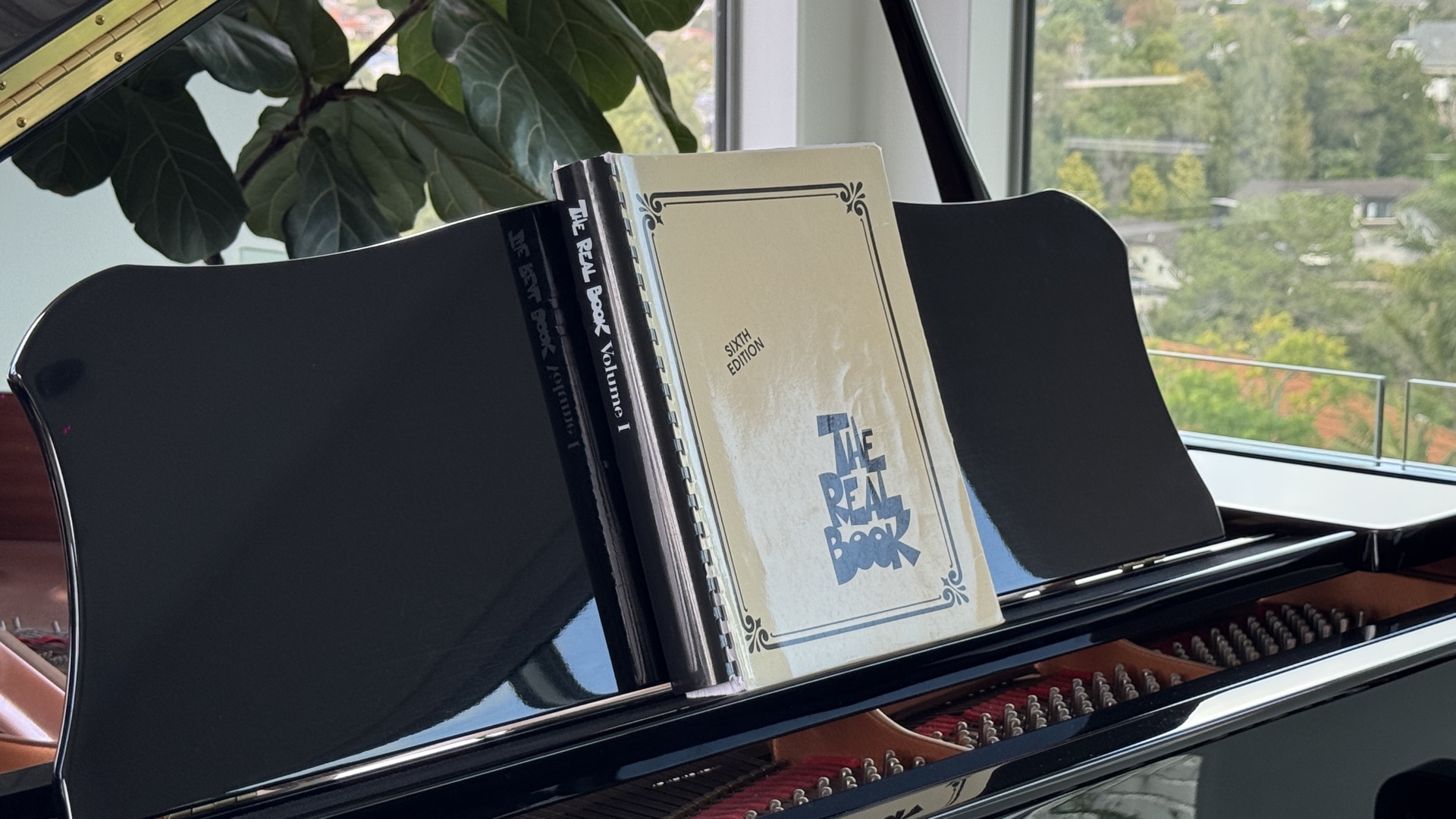 Lead sheet with melody and chord symbols on a piano music stand